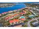 Beautiful waterfront community with red tile roofs, lush landscaping, community pool, and stunning views of the bridge at 445 Bouchelle Dr # 202, New Smyrna Beach, FL 32169
