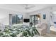 Main bedroom with sliding glass doors leading to a private balcony at 445 Bouchelle Dr # 202, New Smyrna Beach, FL 32169