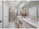 Elegant bathroom with dual vanities and a large walk-in shower at 5338 Spoonflower Ct, Saint Cloud, FL 34771
