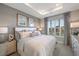 Main bedroom with plush bedding and a neutral color palette at 5338 Spoonflower Ct, Saint Cloud, FL 34771