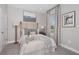 Bright bedroom with a queen-size bed and window at 5338 Spoonflower Ct, Saint Cloud, FL 34771