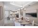 Elegant dining room with a round table, chandelier, and statement artwork at 5338 Spoonflower Ct, Saint Cloud, FL 34771