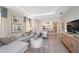 Spacious living room with sectional sofa, large TV, and open floor plan at 5338 Spoonflower Ct, Saint Cloud, FL 34771