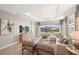 Open living space showcasing a comfortable seating arrangement and water views at 5338 Spoonflower Ct, Saint Cloud, FL 34771