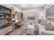 Home office with built-in shelving and comfortable seating area at 5338 Spoonflower Ct, Saint Cloud, FL 34771
