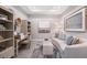Bright home office features built-in shelving and a comfortable seating area at 5338 Spoonflower Ct, Saint Cloud, FL 34771