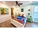 Bedroom with a beach-themed decor and en-suite bathroom at 8056 Shaker St, Kissimmee, FL 34747