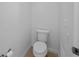 Small, clean bathroom with toilet and tile flooring at 1022 Whirlaway Dr, Kissimmee, FL 34744