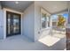 Modern front entrance with glass and dark brown door at 12027 Language Way, Orlando, FL 32832