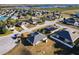 Aerial view of a quiet residential neighborhood with single-Gathering homes at 1218 Coda Ct, Dundee, FL 33838