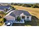 One-story house with gray roof, landscaping, and a driveway at 1218 Coda Ct, Dundee, FL 33838