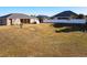Spacious backyard with a view of neighboring homes at 1218 Coda Ct, Dundee, FL 33838