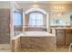 Relaxing bathroom with a soaking tub and double vanity at 1218 Coda Ct, Dundee, FL 33838