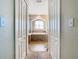 View into a bathroom with a garden tub and double door closets at 1218 Coda Ct, Dundee, FL 33838