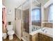 Bathroom features a walk-in shower and a separate tub at 1218 Coda Ct, Dundee, FL 33838