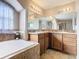 Bathroom boasts double sinks, large mirror, and corner vanity at 1218 Coda Ct, Dundee, FL 33838