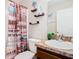 Clean bathroom with a shower/tub combo and vanity at 1218 Coda Ct, Dundee, FL 33838
