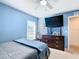 Bedroom with a double bed and large TV at 1218 Coda Ct, Dundee, FL 33838