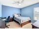 Light blue bedroom with a double bed and home office at 1218 Coda Ct, Dundee, FL 33838