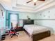 Bright bedroom with a double bed, a desk, and ceiling fan at 1218 Coda Ct, Dundee, FL 33838