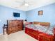 Bedroom with a trundle bed and wood dresser at 1218 Coda Ct, Dundee, FL 33838