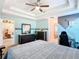 Bedroom with a double bed, dresser, gaming chair, and a view of the living room at 1218 Coda Ct, Dundee, FL 33838