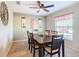 Dining room with dark wood table, six chairs, and window view at 1218 Coda Ct, Dundee, FL 33838