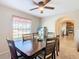 Bright dining room features a wood table and kitchen view at 1218 Coda Ct, Dundee, FL 33838