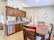 Bright kitchen features stainless steel appliances and wood cabinets at 1218 Coda Ct, Dundee, FL 33838