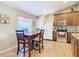 Kitchen nook with wood table and chairs, near window at 1218 Coda Ct, Dundee, FL 33838