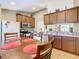 Eat-in kitchen with stainless steel appliances and wood cabinets at 1218 Coda Ct, Dundee, FL 33838