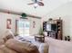 Spacious living room with large sectional sofa and TV at 1218 Coda Ct, Dundee, FL 33838