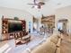 Open living room, features a sectional sofa and TV at 1218 Coda Ct, Dundee, FL 33838