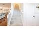 Staircase with carpeted steps and white railing at 1392 Indiana Ave, Winter Park, FL 32789