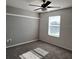 Bright bedroom with window and ceiling fan at 16575 Centipede St, Clermont, FL 34714