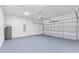 Attached garage with painted floor and shelving at 16730 Sw 50Th Cir, Ocala, FL 34473