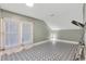 Upstairs bedroom with patterned flooring and window at 1825 E Kaley Ave, Orlando, FL 32806