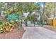 Entrance to Hourglass Park, featuring a gated entry and lush landscaping at 1825 E Kaley Ave, Orlando, FL 32806