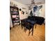 Cozy dining area with a table and chairs, adjacent to a well-stocked bookshelf at 2810 Plaza Terrace Dr # 2810, Orlando, FL 32803