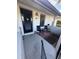 Inviting front porch with black door, two rocking chairs, and a small sitting area at 2810 Plaza Terrace Dr # 2810, Orlando, FL 32803