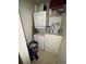 Small laundry room with stackable washer and dryer units at 2810 Plaza Terrace Dr # 2810, Orlando, FL 32803