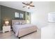 Main bedroom with green accent wall and ample natural light at 29 Hemlock Pass, Ocala, FL 34472