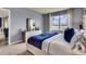 Serene bedroom with a dresser and a view of the backyard at 2952 Waterlily Way, Poinciana, FL 34759