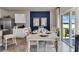 Bright dining area with table and chairs, adjacent to kitchen at 2952 Waterlily Way, Poinciana, FL 34759