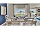 Elegant dining room with table, chairs and large windows at 2952 Waterlily Way, Poinciana, FL 34759