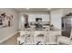 Kitchen with white cabinets, granite countertops, and stainless steel appliances at 2952 Waterlily Way, Poinciana, FL 34759