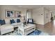 Spacious living room with an L-shaped sofa and a coffee table at 2952 Waterlily Way, Poinciana, FL 34759
