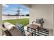 Relaxing patio with seating area and small table at 2952 Waterlily Way, Poinciana, FL 34759