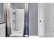 Shower stall with glass enclosure and built-in shelving at 2952 Waterlily Way, Poinciana, FL 34759