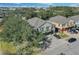 Aerial view of townhouses with private driveways and a tree-lined street at 3720 San Jacinto Cir, Sanford, FL 32771